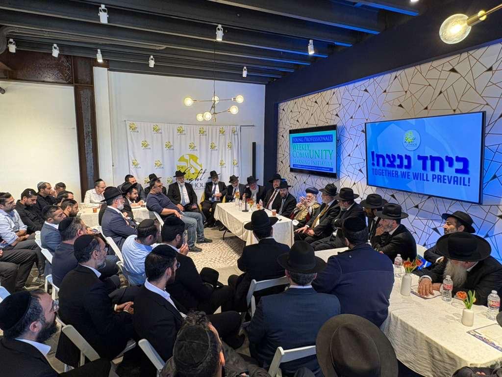 A small group learning Torah around a table